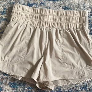 JoyLab athletic shorts. Built in panties. Pockets.Tan. Like new condition.